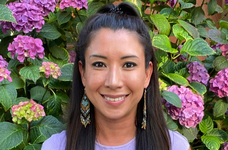 Meiling Wong registered clinical counsellor closeup on her face with vibrant pink and purple flower background